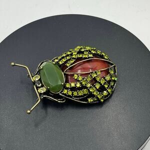 "Rara Avis," Signed Iris Apfel Green Rhinestone Faux Carnelian Beetle
Bug Brooch